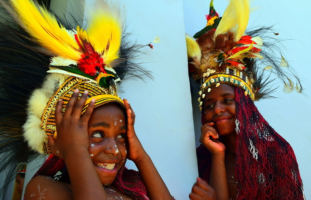 Festival in Dekai, West Papua Young Papuan girl with bird of paradise headdress